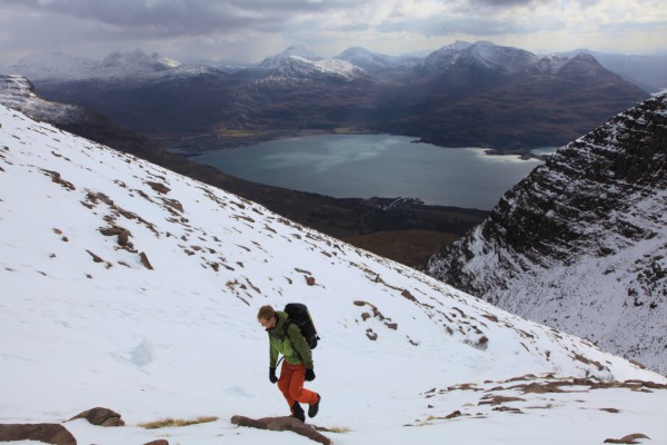 Climbing Beinn Alligin, Torridon, with Loch Maree in the background, Scotland, UK